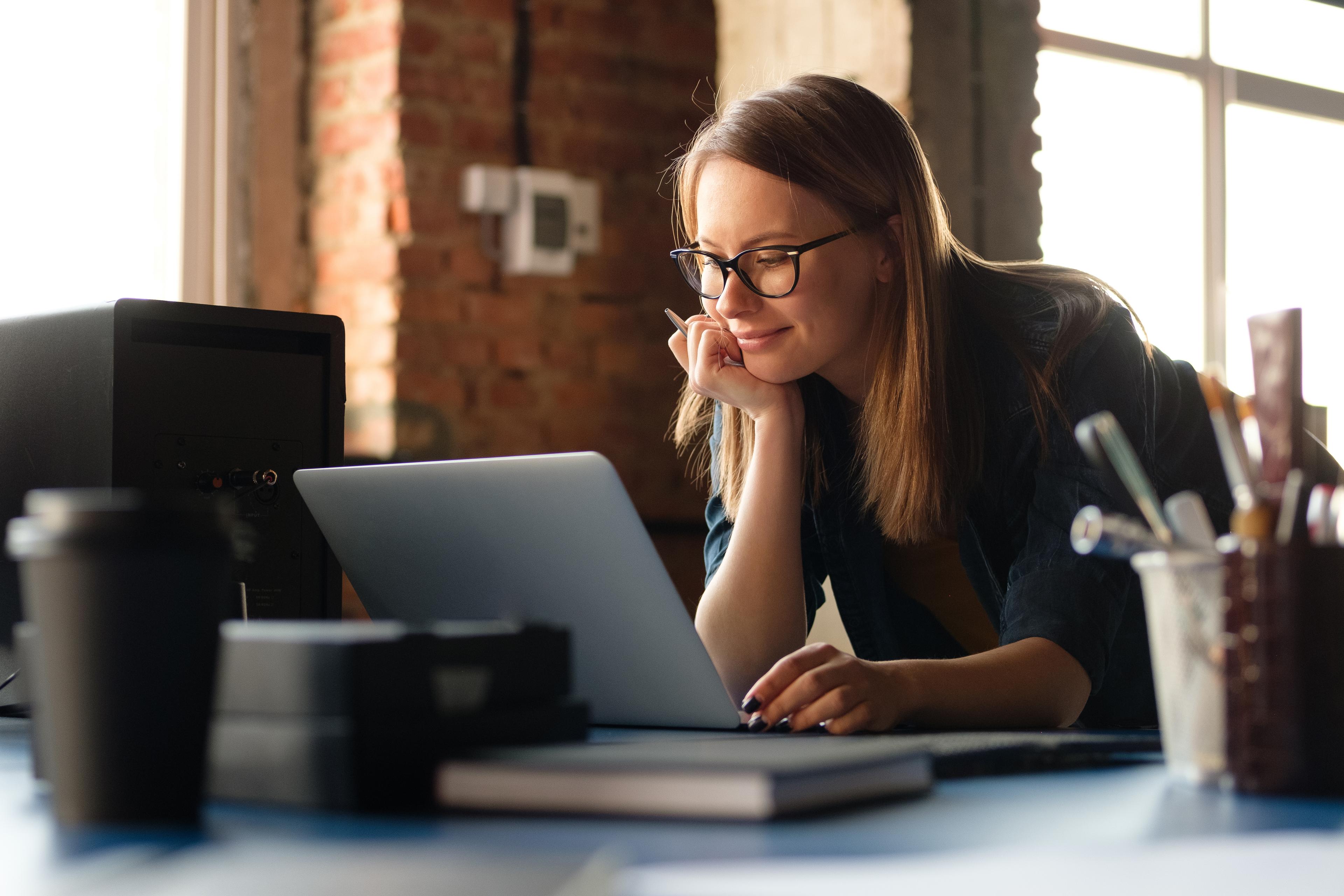 A professional woman working on her laptop